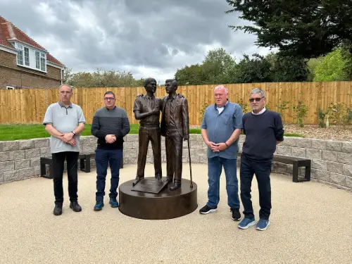 Survivors and former Treloar's pupils, Richard Wagner, Ade Gallagher, Steve Nicholls and Gary Webster stand by the Treloars Memorial.